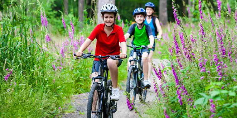 Kids Riding On Mountain Bikes in the Nature
