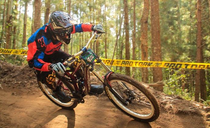 cyclist complete with protective equipment while  doing downhill biking