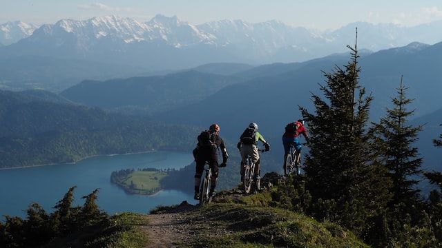 bikers on a mountain bike going downhill